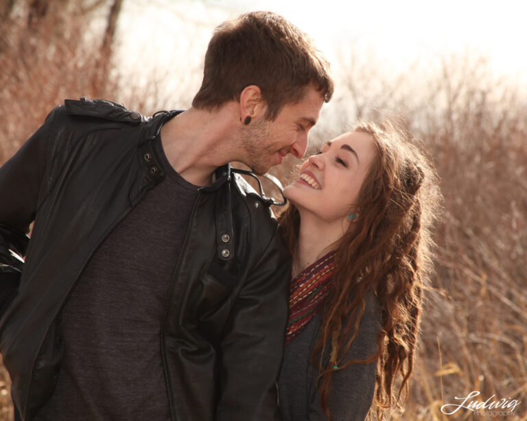 Couples gazing at each other during a photoshoot in Wyoming, outdoors