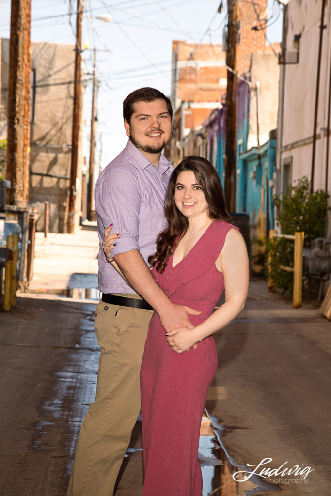 a young couple smiling and having fun outdoors in Wyoming downtown laramie