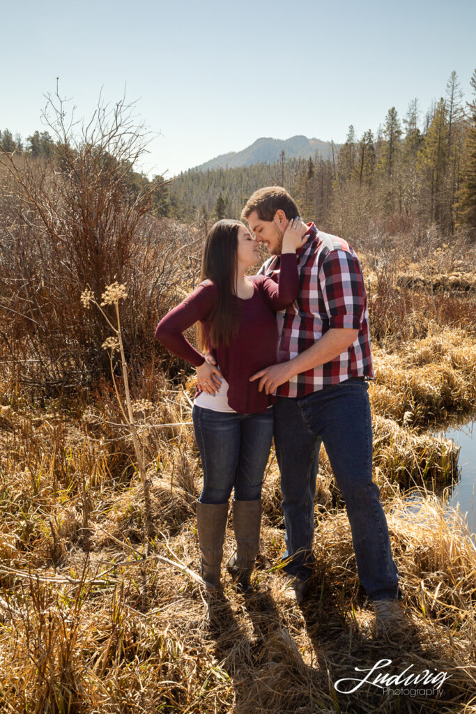 image of a couple smiling outdoors at Pilot Hill in Wyoming