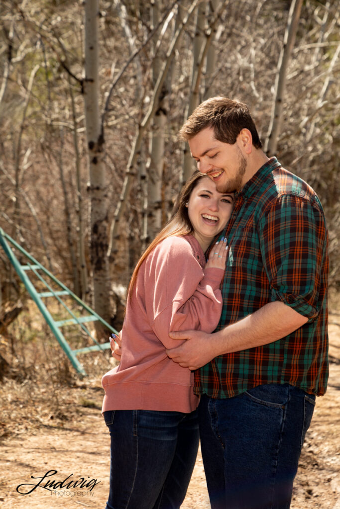 a young couple smiling and having fun outdoors in Wyoming