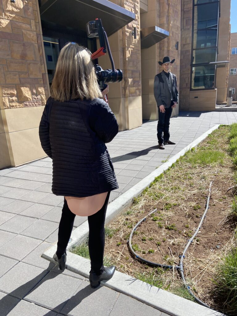 Photographer Anne Brande photographing a University of Wyoming senior at the Engineering Education Research Building in Laramie Wyoming. Ludwig