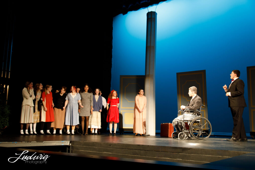 Actors on stage during Annie the musical