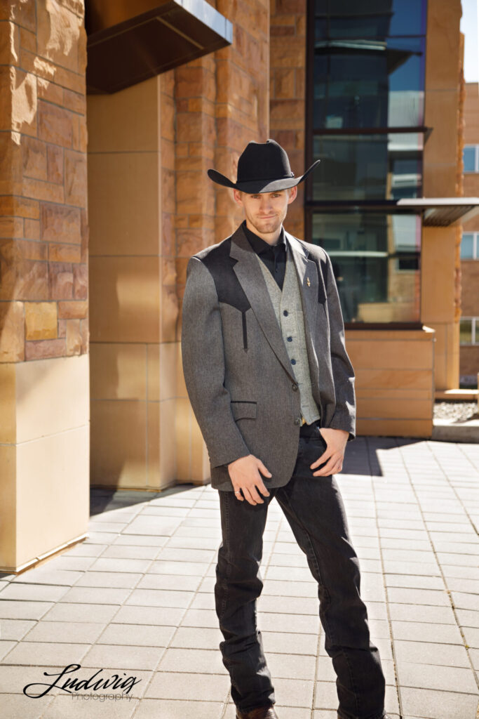 Portrait of a University of Wyoming student in front of the Engineering Education Resource Building in Laramie, Wyoming. Ludwig Photography