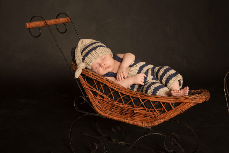 newborn photo in basket